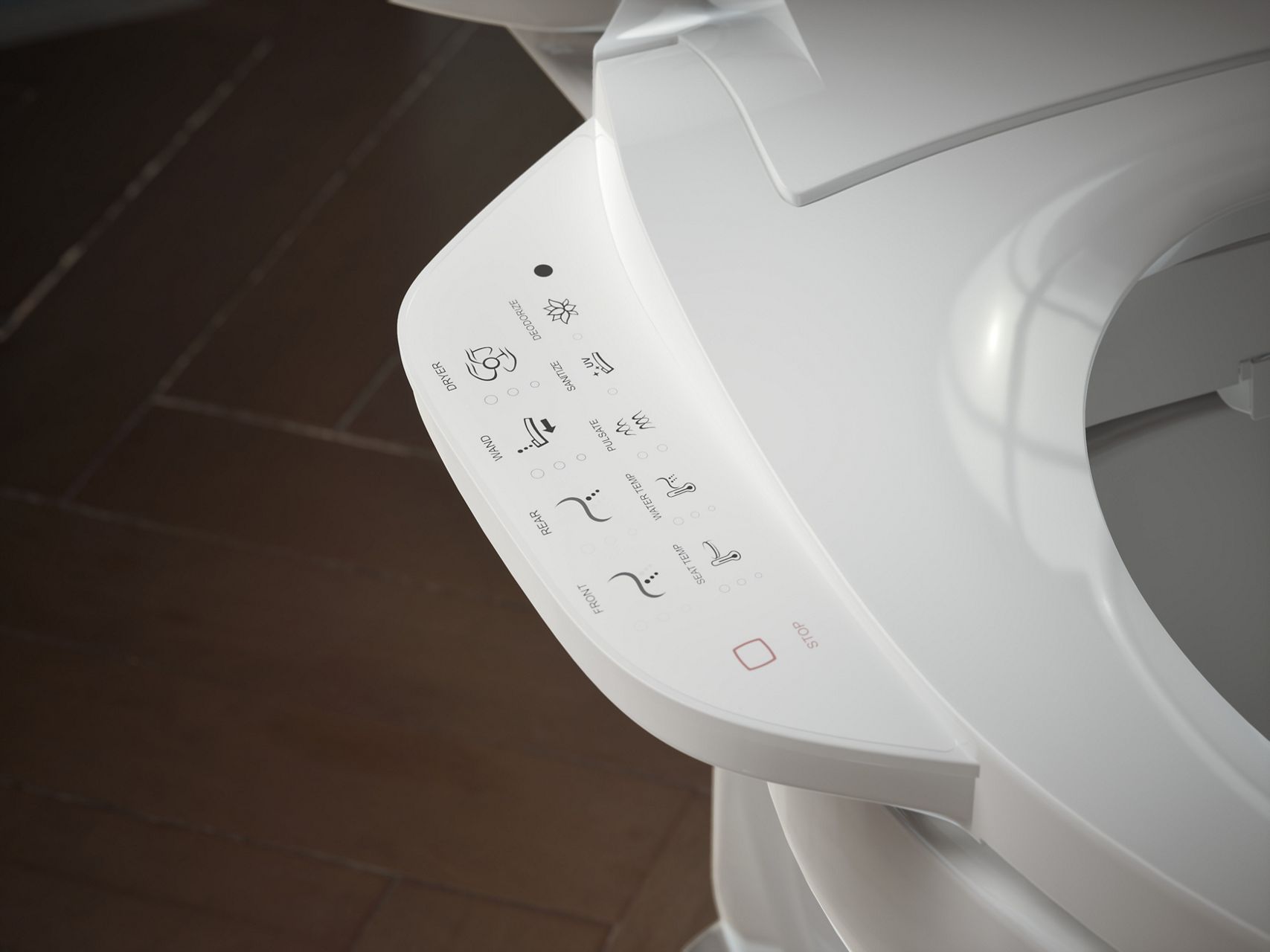 Close up of a bidet seat side control panel with touch buttons and icons